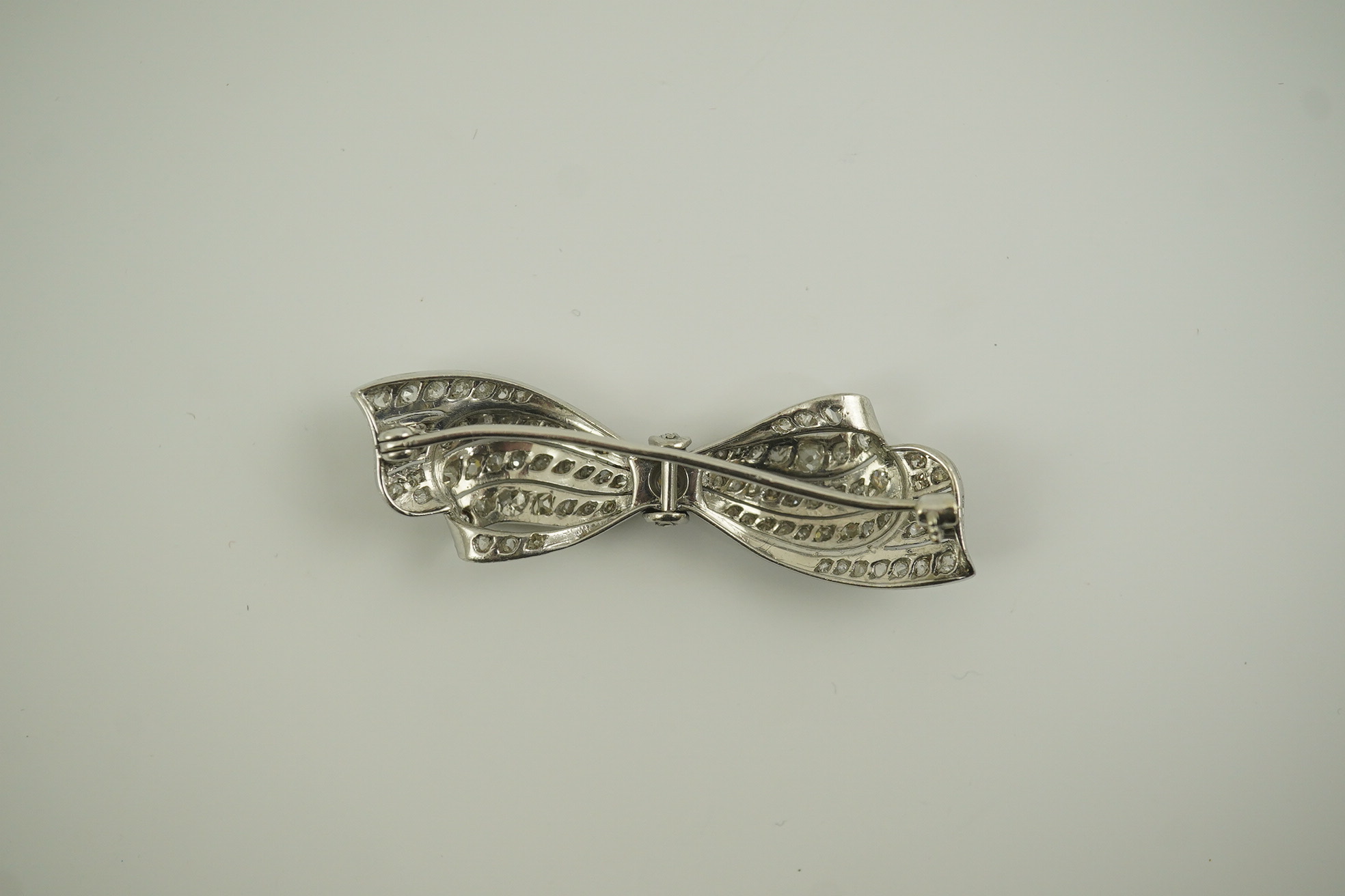 A 1940's platinum? and diamond cluster set ribbon bow brooch